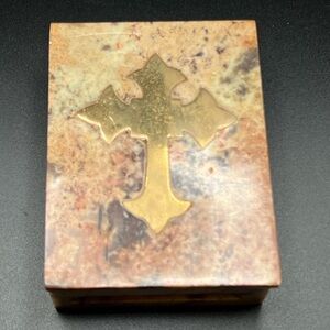 vintage hand-carved stone trinket box with a brass cross inlay